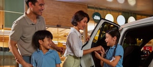 a family getting out of a car