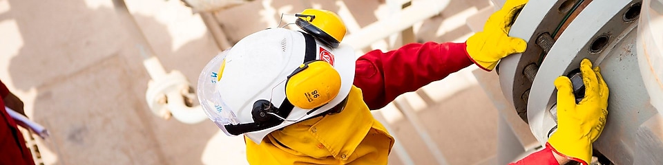 Worker wearing safety mask and gloves