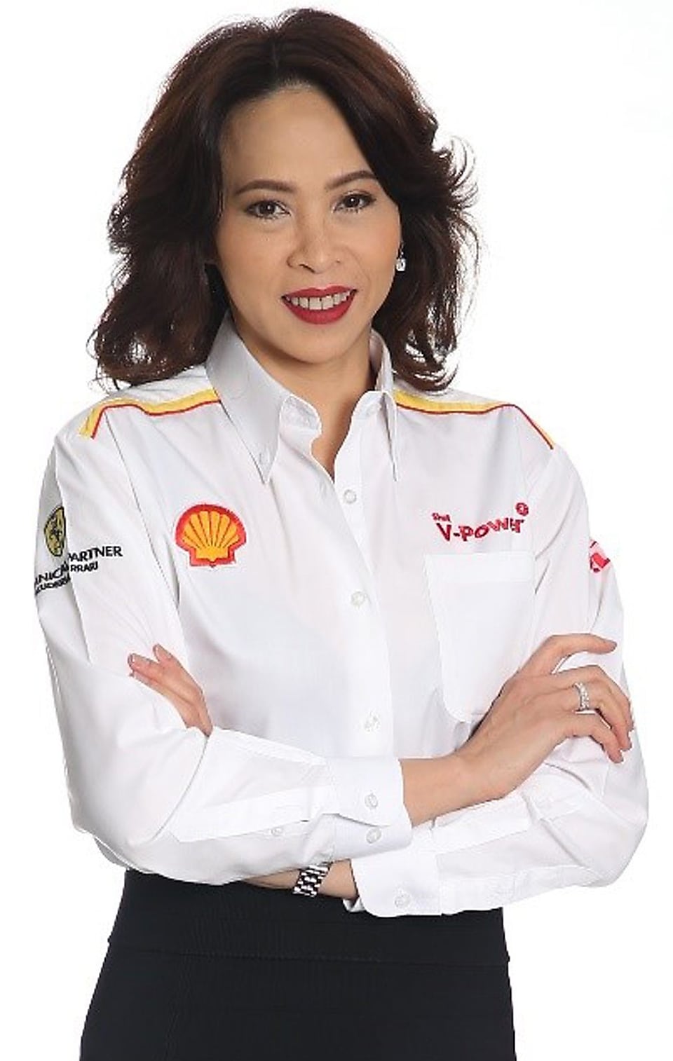 Lady smiling in white shirt with shell
