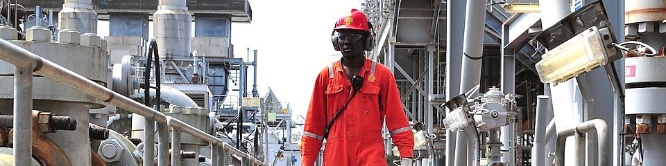 Engineer walking along an offshore platform in Nigeria