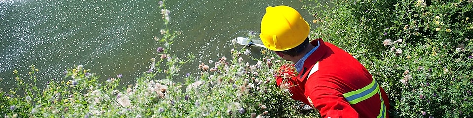 Man taking water samples from a river