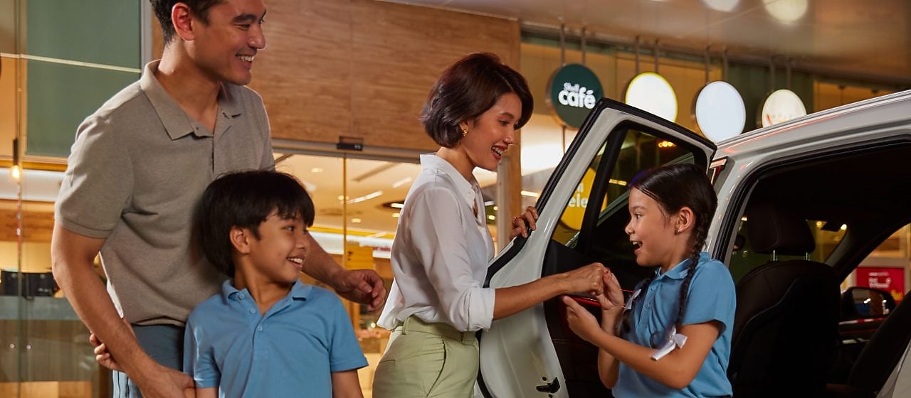 a family getting out of a car