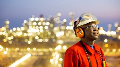Man with goggles and hard hat in red-uniform