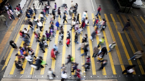 People crossing a busy street in Hong Kong